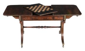 A Regency rosewood, ebony and brass inlaid sofa and games table, circa 1815