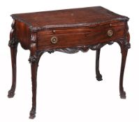 A George III mahogany side table, circa 1770, the serpentine shaped top with decorative leaf