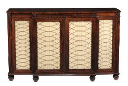 A George IV rosewood breakfront side cabinet , circa 1825