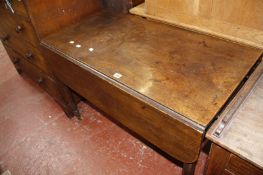 A George III mahogany dropleaf table with a single end drawer on turned supports.