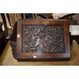 A corner cabinet heavily carved with a phoenix and two oak panels of wheat sheaf.