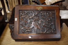 A corner cabinet heavily carved with a phoenix and two oak panels of wheat sheaf.