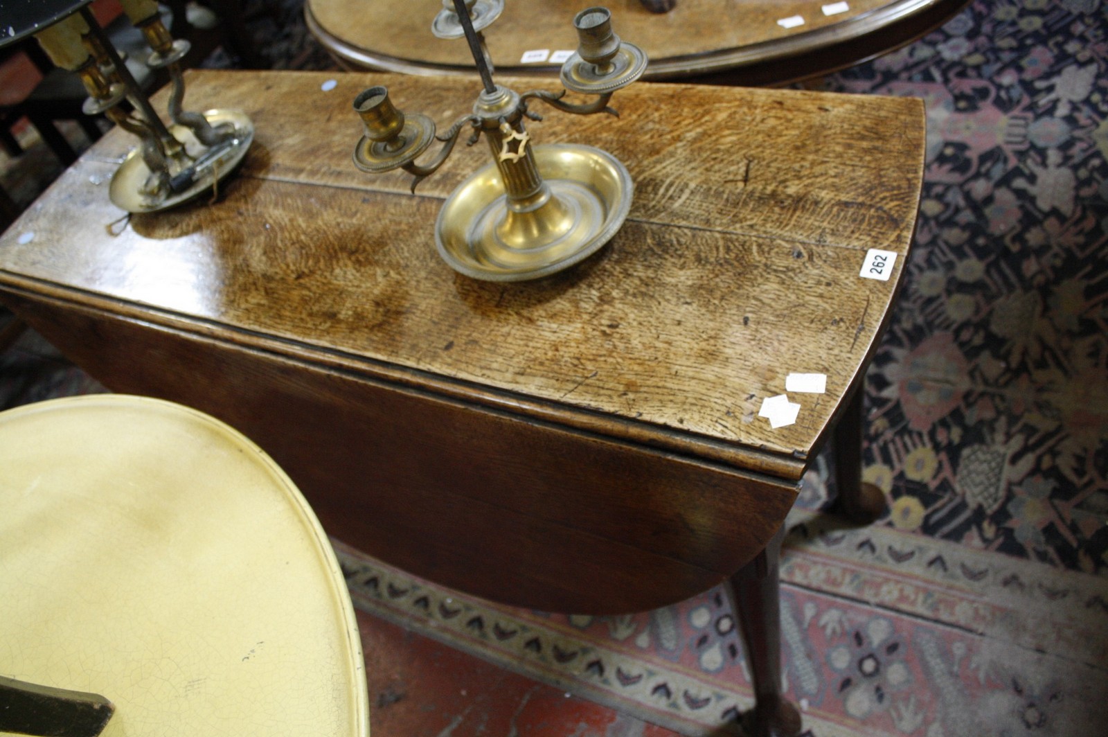 A George I oak gateleg table, early 18th century 71cm high, 135cm extended