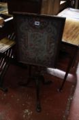 A 19th century mahogany pole screen, with a glazed needle work screen depicting a Phoenix amongst