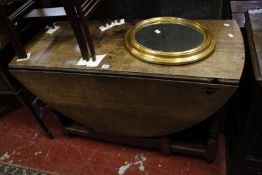 An early 19th century oak gateleg table.