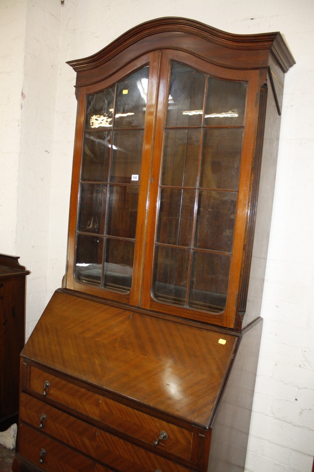 An Edwardian bureau bookcase with an arched cornice.220cm high x 91cm wide.