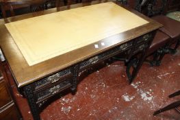 A Victorian leather lined writing table with blind fret carving to the front and legs.107cm x 58cm.