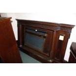 An Edwardian mahogany breakfront overmantle mirror with classical brass capped columns and blind