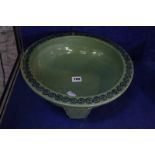 A Chinese green bowl on three short legs, decorated with dragon, 34cm in diameter