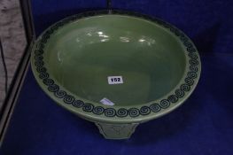 A Chinese green bowl on three short legs, decorated with dragon, 34cm in diameter