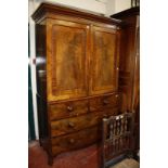 A 19th Century mahogany linen press enclosing shelves with two short and two long drawers 209cm