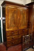 A 19th Century mahogany linen press enclosing shelves with two short and two long drawers 209cm