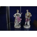 A pair of Continental porcelain models of musician and companion, 22.5cm high