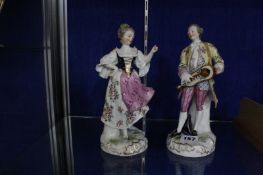 A pair of Continental porcelain models of musician and companion, 22.5cm high
