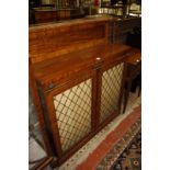 A late Victorian mahogany chiffonier with a brass gallery to the shelf and twin panelled cupboards