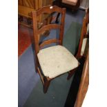 A set of eight ladder back chairs with rush seats.