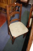A set of eight ladder back chairs with rush seats.