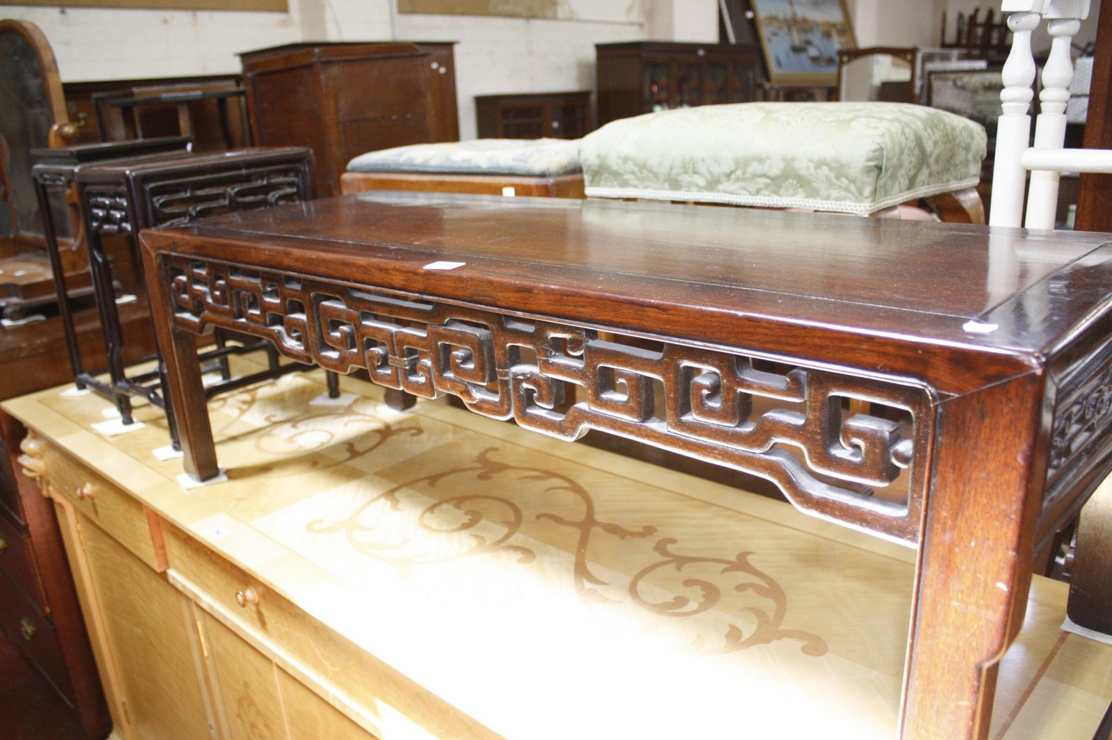 An Oriental hardwood low table, together with two further tables