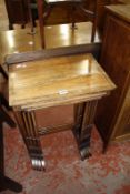 A nest of four rosewood and cross banded quartetto occasional tables, in Regency style,