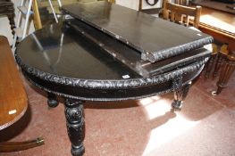 A stained dark oak late 19th Century dining table with two extra leaves. 225cm extended x 122cm.