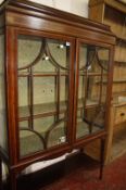 An Edwardian mahogany china display cabinet, raised on square tapering supports.109cm wide x 169cm