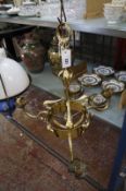 A brass hanging candelabra light