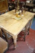 A Victorian pine plank top kitchen table with a single end drawer on turned legs.121cm x 86cm.