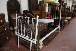 A brass and white painted bedframe (single), another pair of white painted bed ends and a pair