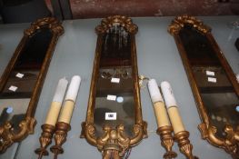 Three gilt composition twin light girandoles, 77cm long