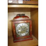 A Mappin & Webb Ltd red japanned two-train mantel clock, Roman numeral dial, 32.5cm high (not
