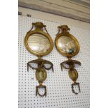 A pair of George III style giltwood wall mirrors surmounted with urns with ram's mask handles 88cm