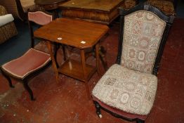 A Victorian ebonized nursing g chair, and Edwardian nursing chair, spindle back chair and a lamp