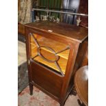 An Edwardian mahogany and glazed music cabinet, early 20th century and a mahogany and cross banded