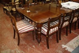 A Victorian mahogany extending dining table on turned supports plus two extension leaves