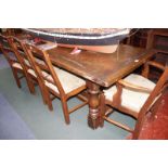 An oak refectory table on column turned supports with a uniting cross stretcher.224cm x 84cm.