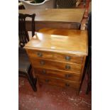 A small chest of drawers and a reproduction canterbury.