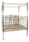 A brass four poster bed in Victorian style, 20th century, the ring finials above canopy rails and