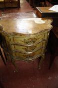 An Italian painted commode chest of serpentine outline