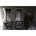 A pair of Japanese Satsuma vases on tripod shaped legs, decorated with wise men and dragon 30cm high