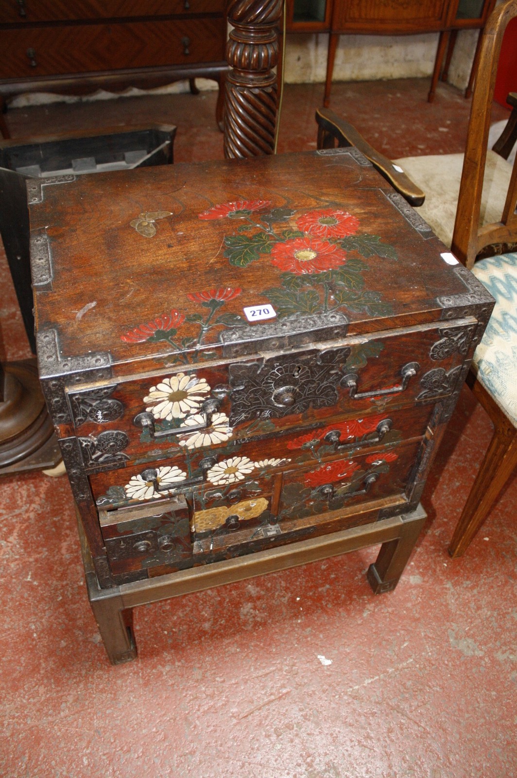 An Oriental lacquer cabinet on stand