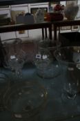 A pair of glass tall stemmed candle holders, with shades, together with a selection of other large