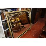 A Regency style gilt and ebonised wall mirror 113 x 141cm