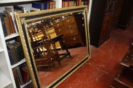 A Regency style gilt and ebonised wall mirror 113 x 141cm
