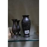 A pair of Japanese bronze vases, relief decorated, inverse baluster shaped, 15cm high and a pair
