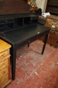 A modern ebonised desk with raised back. 120cm wide