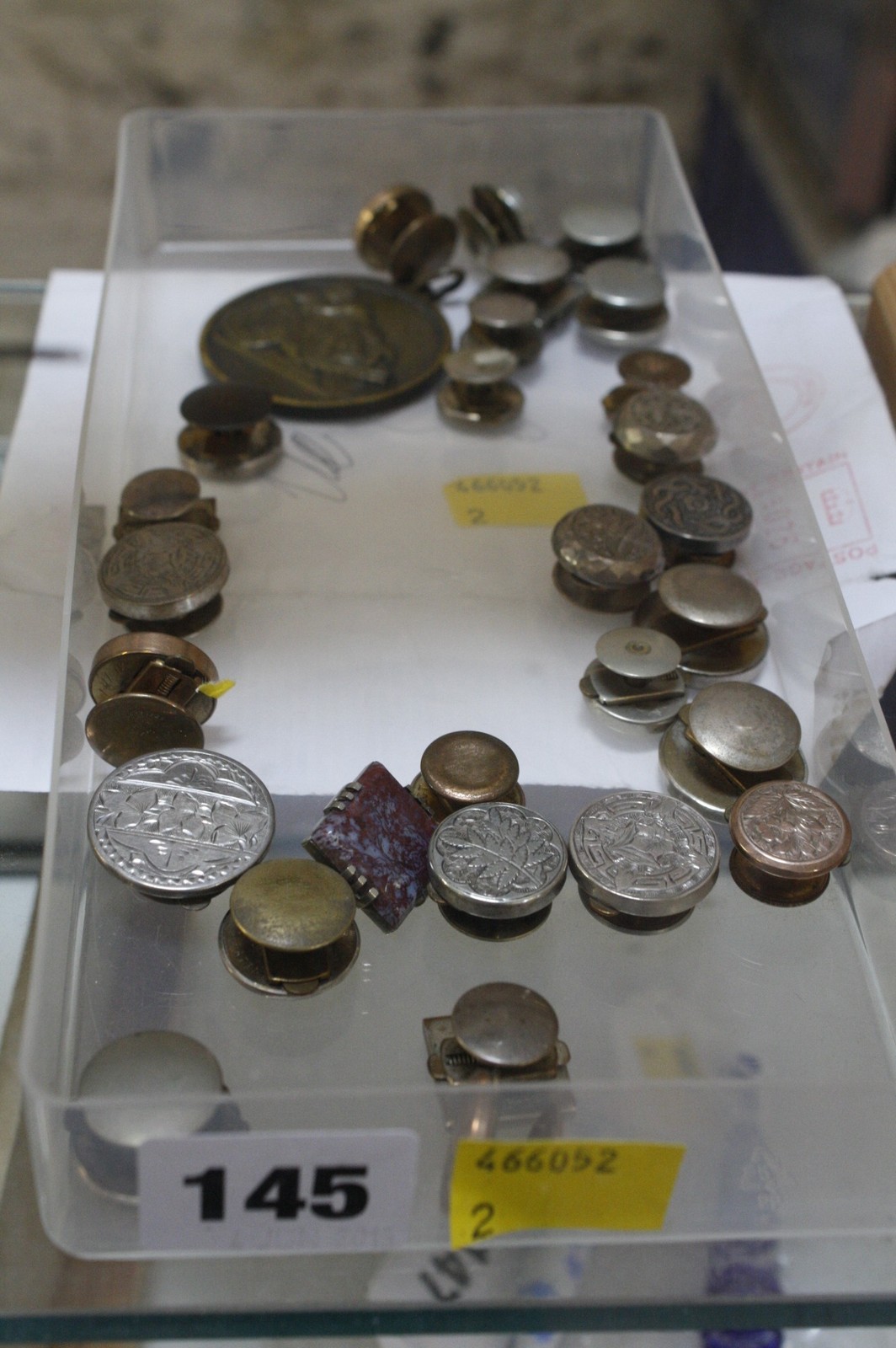 A quantity of assorted buttons and a medallion