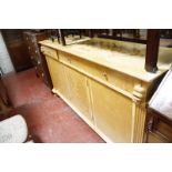 A Linley design sideboard with three frieze drawers flanked by seabeast masks, above cupboards