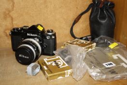 A Nikon camera, 1.4 lens, a prism, two focusing screens, Nikon hot shoe connection, a Nikon 105 lens