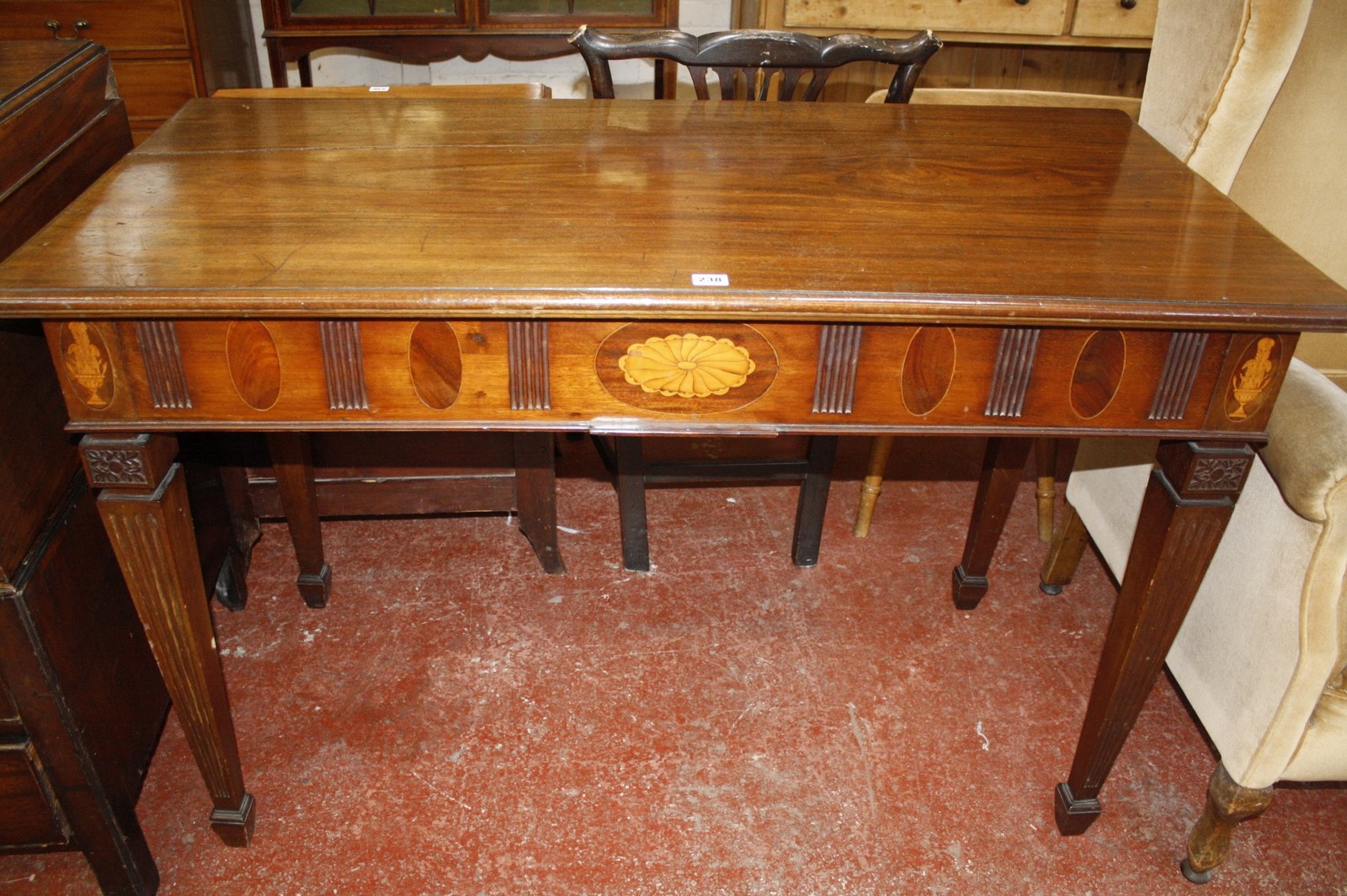 A 19th century mahogany side table with inlaid frieze. 129cm wide x 63cn deep x 85cm high.