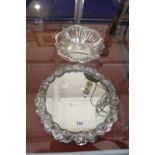 A 20th Century silver coloured metal mirror plateau, leaf and bark decorated, 36cm in diameter and